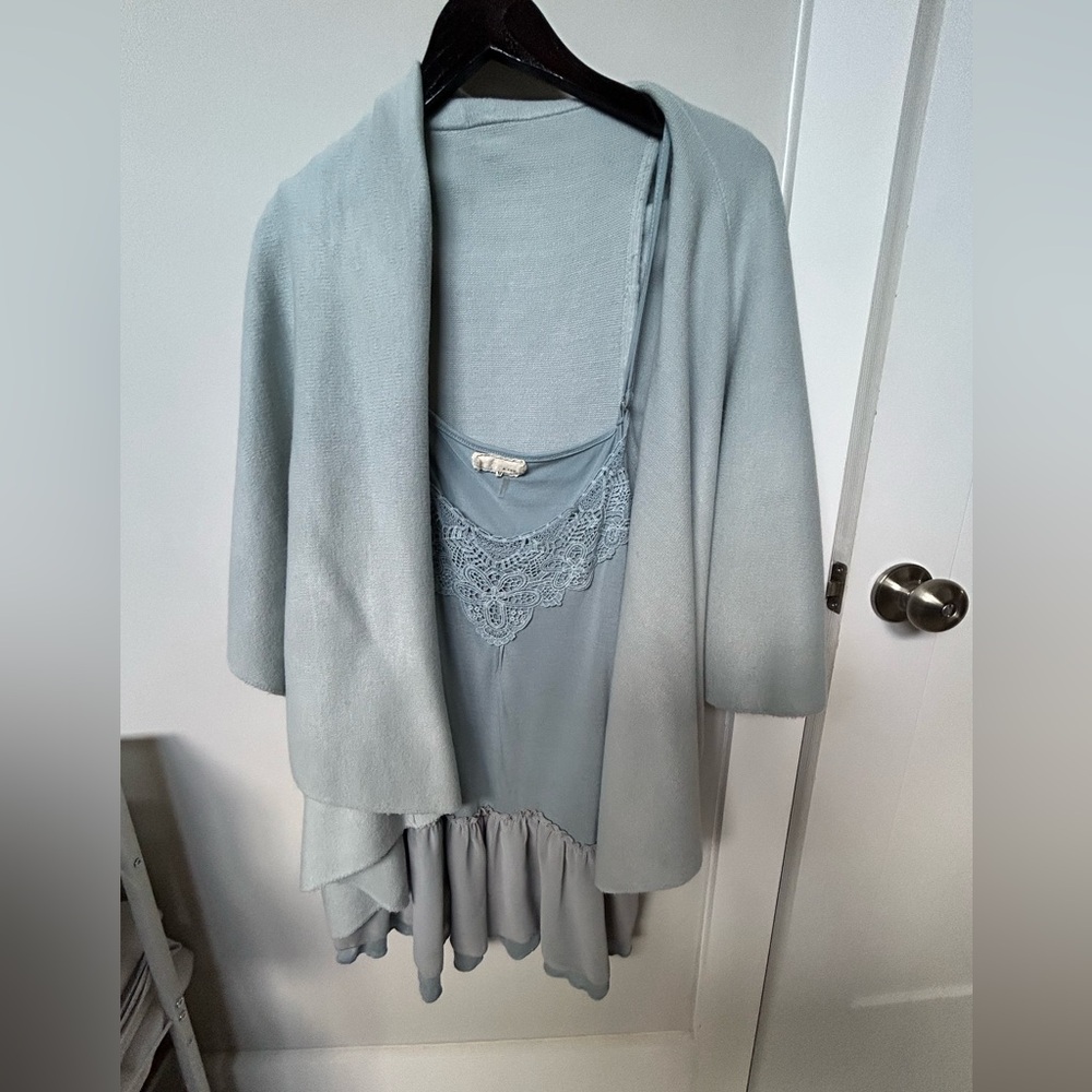 Women’s sleeveless shawl type top. Blue lace top is included with this sweater.
